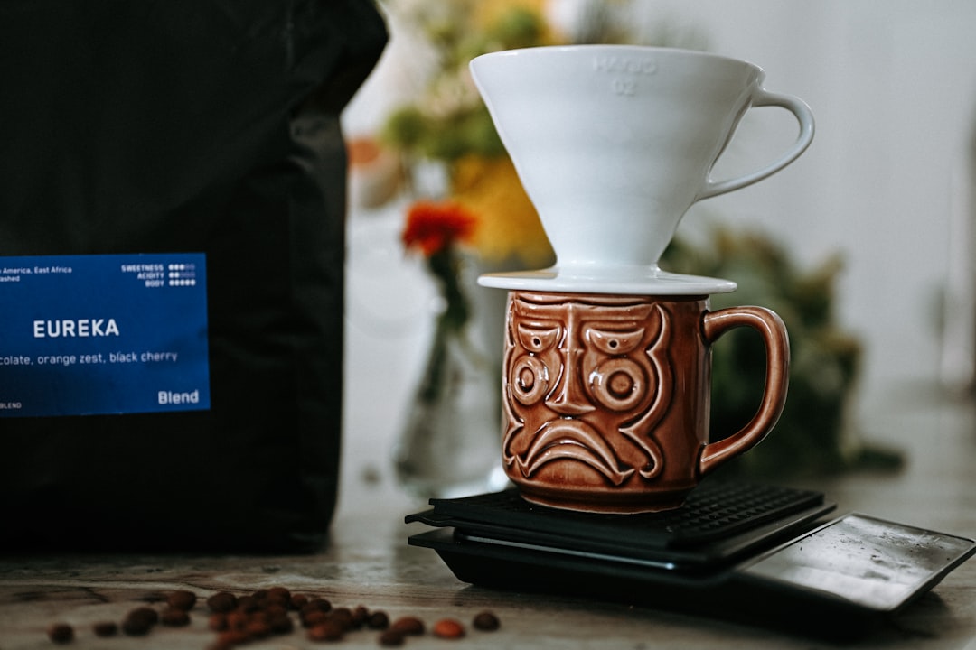 Coffee brewing setup with bag, mug, and filter.