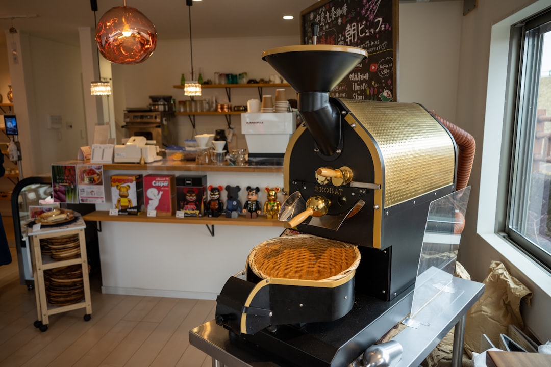 a coffee maker sitting on top of a counter next to a window