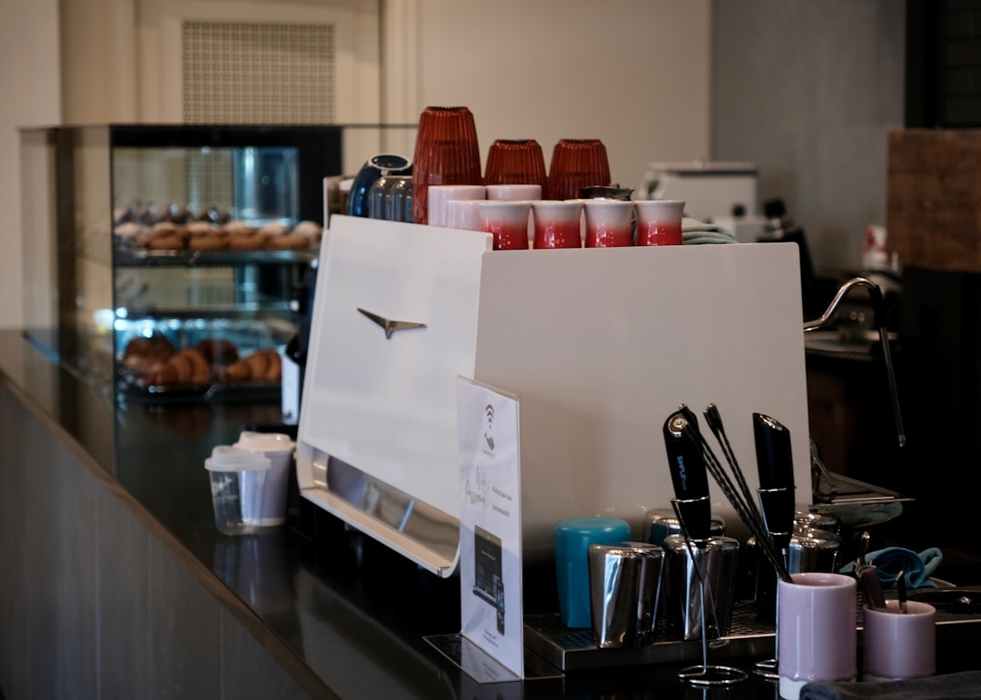 La San Marco La 125 espresso machine with portafilter and coffee cups