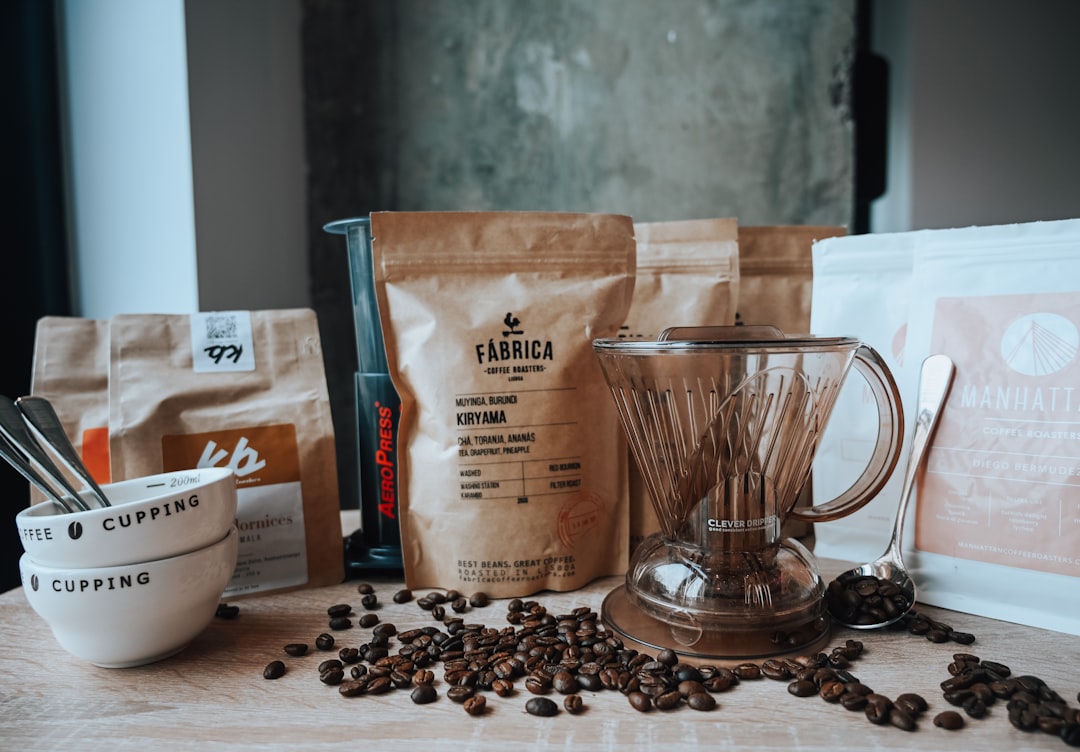A table topped with coffee beans and a blender