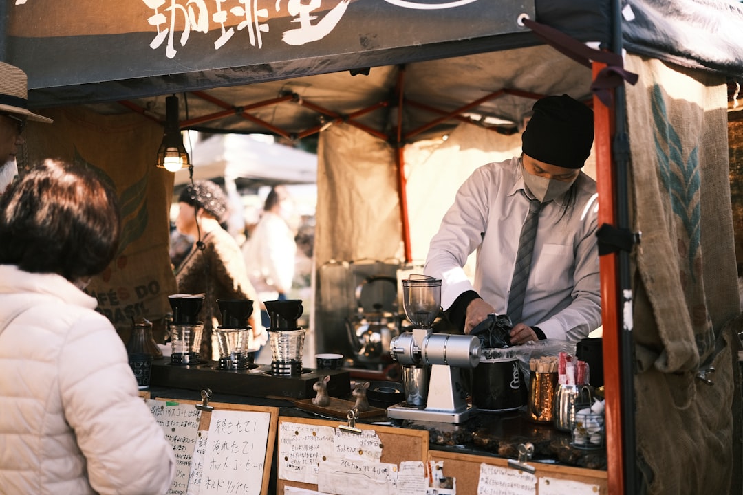 Barista making coffee at an outdoor stall